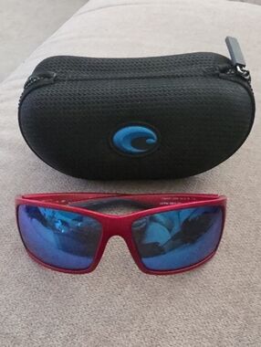 Costa red frame sunglasses with blue mirrored lenses